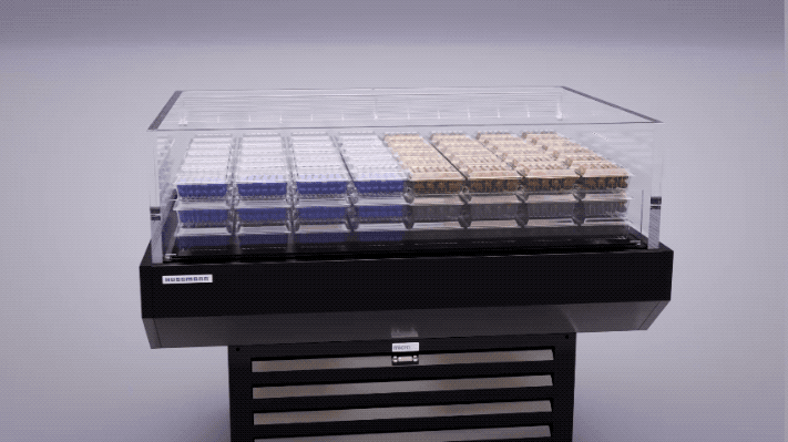 SIM display spinning gif showing all sided visibility and accessibility of packaged blueberries and raspberries that morph into packaged salad bowls