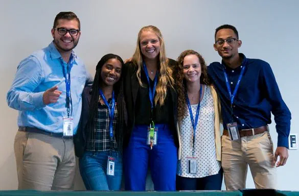 Group of interns smiling for photov