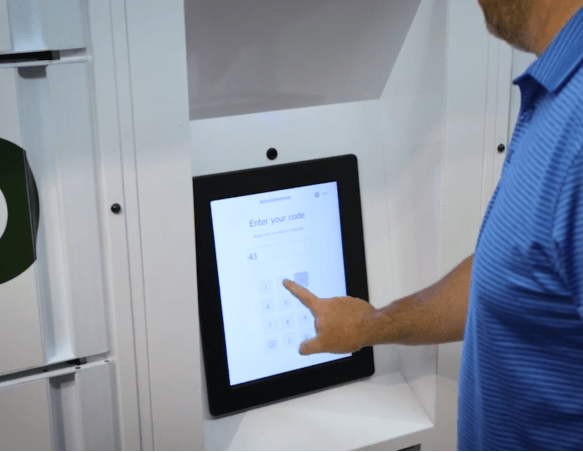 a customer enters their PIN at a secure food locker terminal